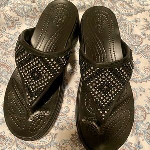 Croc platform flip flops.